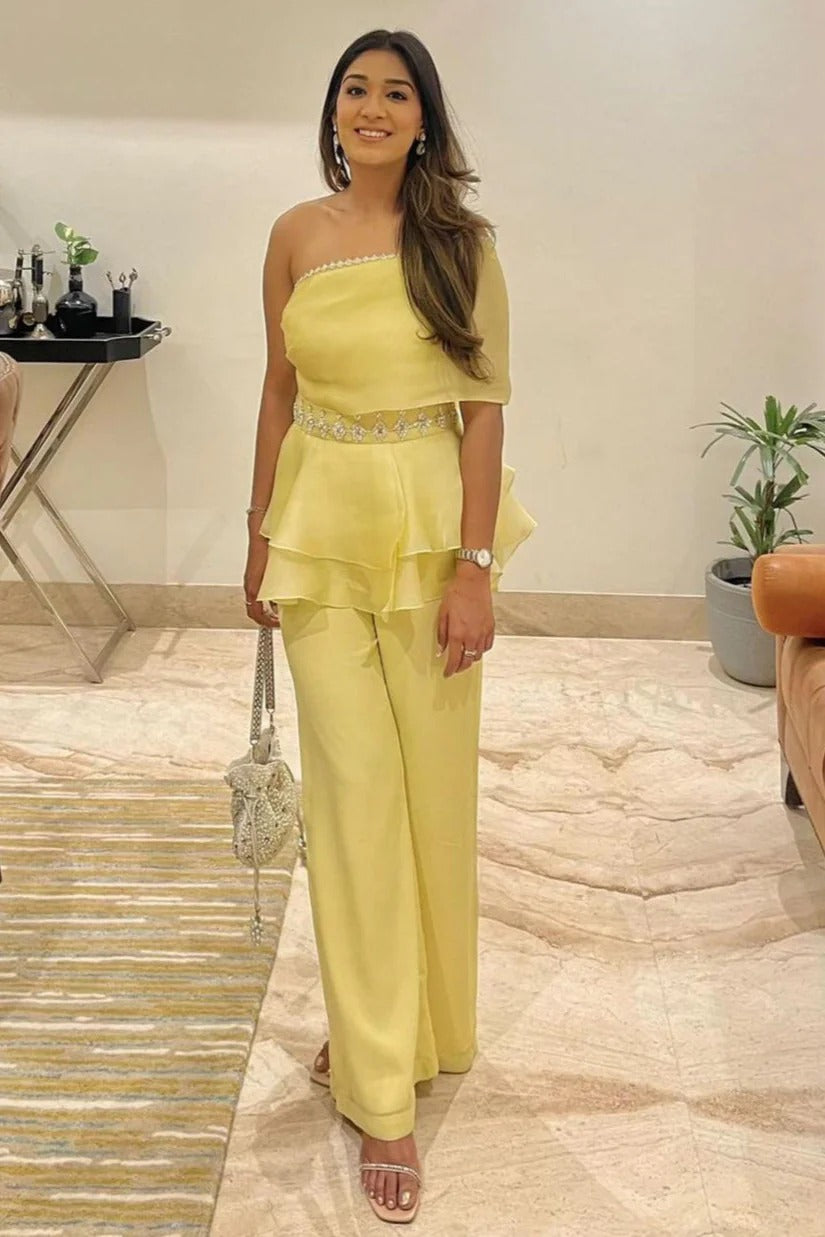 handcrafted embellished peplum top and pants.