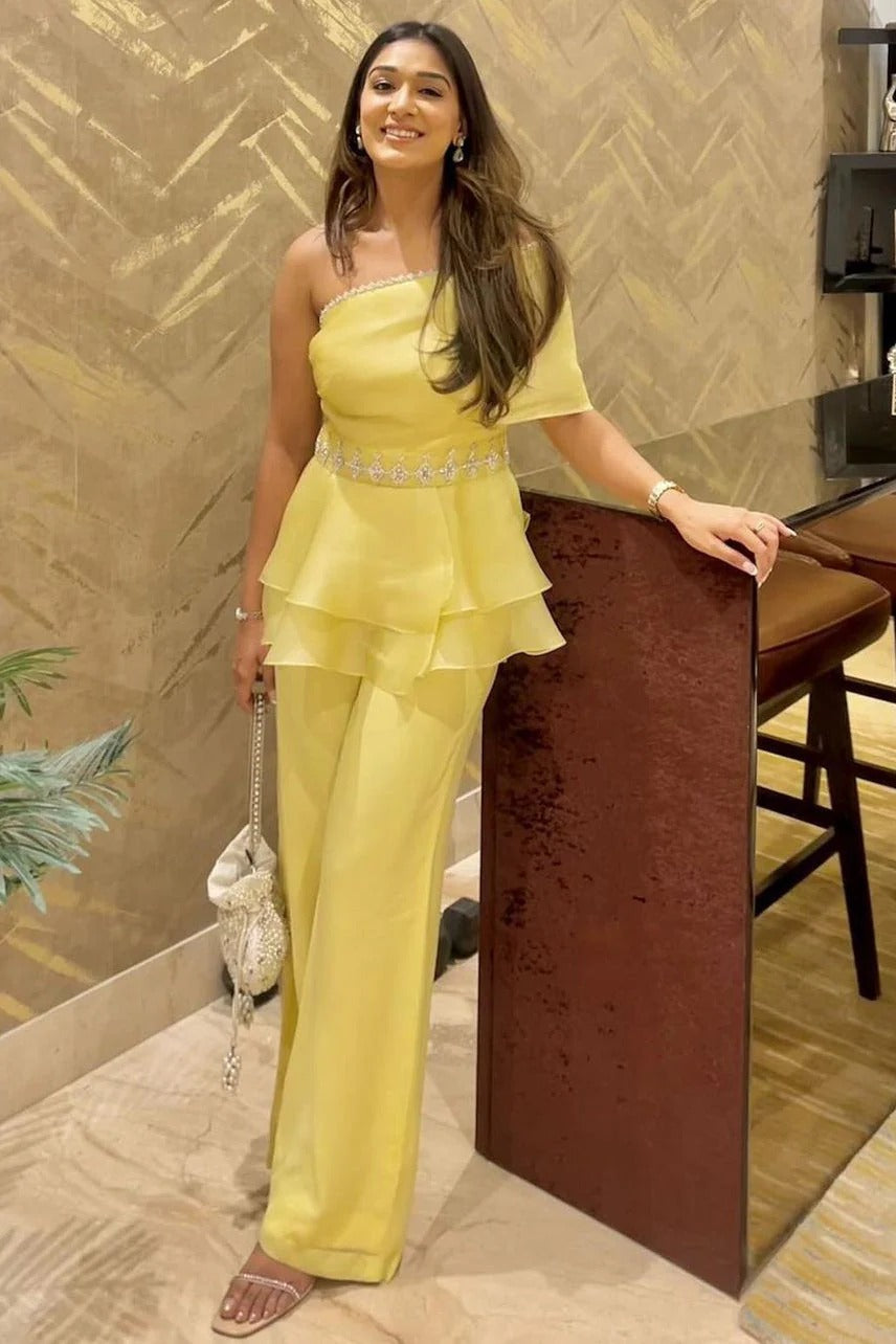 handcrafted embellished peplum top and pants.