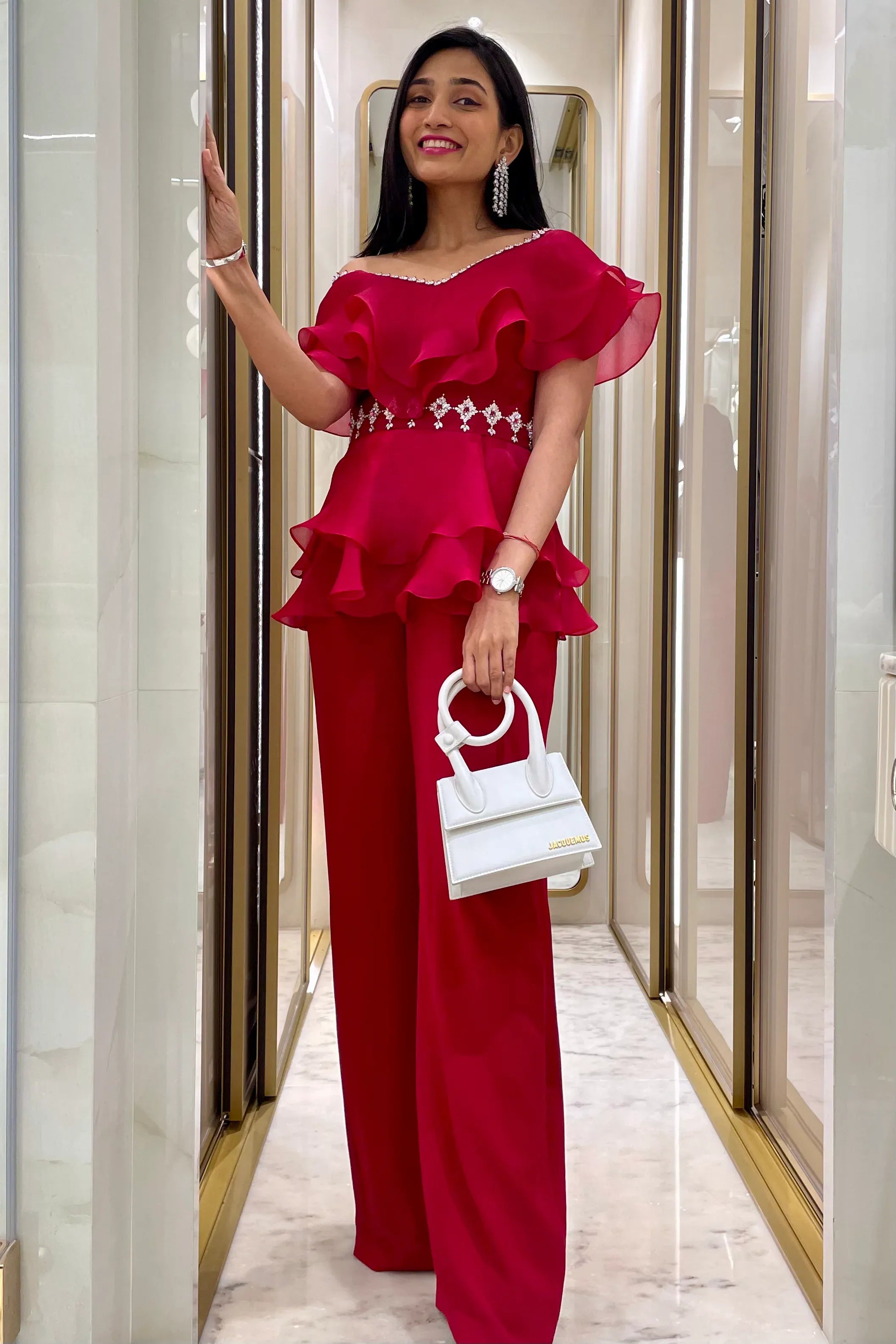 handcrafted embellished peplum top and pants.