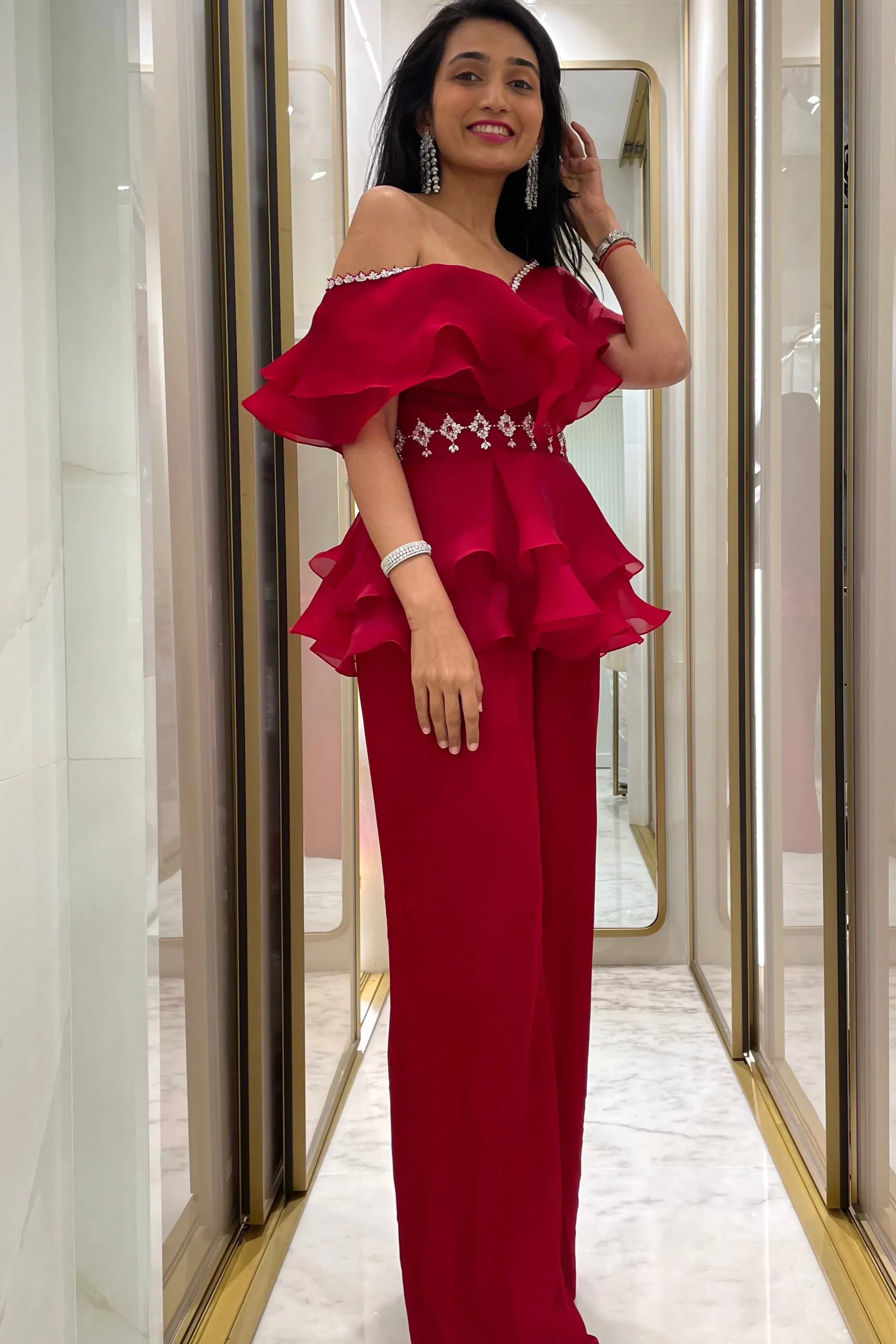 handcrafted embellished peplum top and pants.